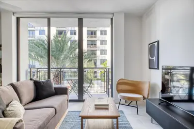 a living room with a couch and a table at Wynwood 1br w gym pool wd nr shops bars MIA-34 in Miami
