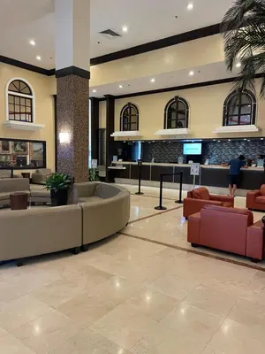a lobby of a hotel with couches and a tv at Miami Sunny Isles Beach Ocean Front Resort Condo with balcony Pool, Beach,Gym,Valet Parking in Sunny Isles Beach