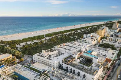 an aerial view of a beach and buildings at Ocean Drive Deco Apt w/2 Queen Beds, Steps 2 Beach in Miami Beach