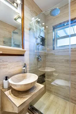 a bathroom with a sink and a glass shower at Surfers Cove - Modern 3 2 w Pool near Calle 8 in Miami