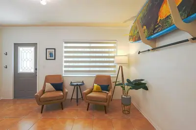 a living room with two chairs and a table at Surfers Cove - Modern 3 2 w Pool near Calle 8 in Miami