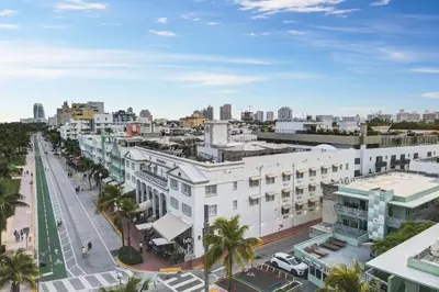 an aerial view of a city with buildings and palm trees at Super Beach Deal, Apt w/2 Queen Beds On Ocean Dr in Miami Beach