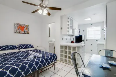 a bedroom with a bed and a dining table at Sunny Ocean Dr Condo, w/2 Queen Beds, South Beach in Miami Beach