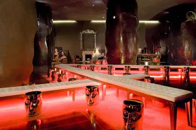 a row of tables in a room with red lights at Modern High Rise One Bedroom at Icon Brickell (W) in Miami