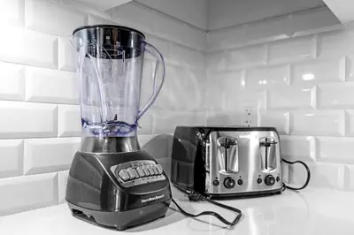 a blender sitting on a counter next to a toaster at Sleek Doral Retreat 1 Bed Oasis With Free Parking in Hialeah Gardens