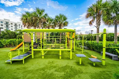 a playground in a park with a slide at Sleek Doral Retreat 1 Bed Oasis With Free Parking in Hialeah Gardens