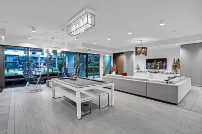 a living room with a couch and a table at Sleek Doral Retreat 1 Bed Oasis With Free Parking in Hialeah Gardens