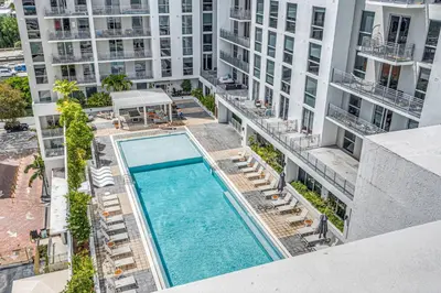 an overhead view of a swimming pool in a building at Gorgeous 3-Bed Retreat Mins from Bayside and Parking in Miami