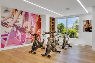 a gym with exercise bikes in a room at Gorgeous 3-Bed Retreat Mins from Bayside and Parking in Miami