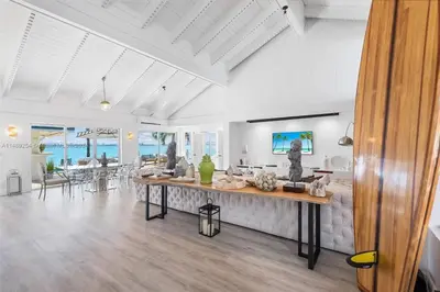 a living room with a large table in the middle at Villa Hashmi Luxury 5BD & 5BA Retreat on North Bay Island in Miami Beach