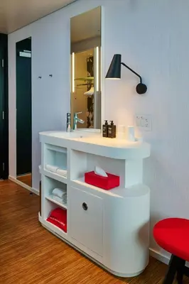 a bathroom with a white sink and a mirror at citizenM Miami South Beach in Miami Beach