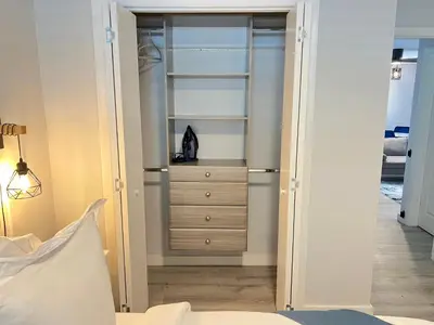 a bedroom with a closet with a dresser at Villa Michloe - Steps from Wilton Drive in Fort Lauderdale