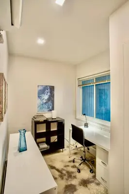 an empty office with a desk and a chair at Walk to Wilton Drive - Spacious & Quiet Villa #2 HOT TUB! in Fort Lauderdale
