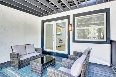 a living room with a chair and a coffee table at Villa Tropicale Stunning 4 Bedroom 4 Bath Home with Pool and BBQ in Miami