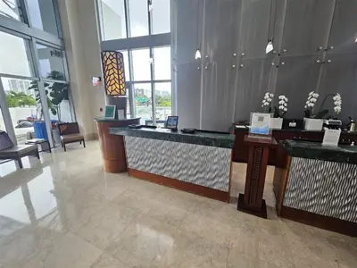 a lobby of a hotel with a reception desk at Mare-1708 A in Aventura
