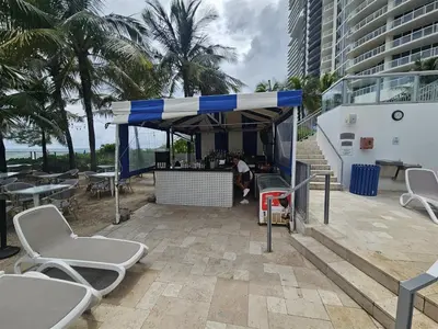 a drink stand on a balcony of a resort at Mare-1708 A in Aventura