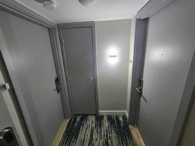 an empty hallway with a door and a rug at Mare-1708 A in Aventura