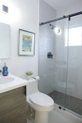a bathroom with a toilet and a glass shower at Apt 2 Miami Designer Apartment in the Upper East-Side in Miami
