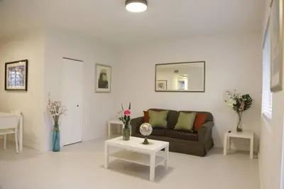 a living room with a couch and two tables at Apt 3 Miami Designer Apartment in the Upper East-Side in Miami