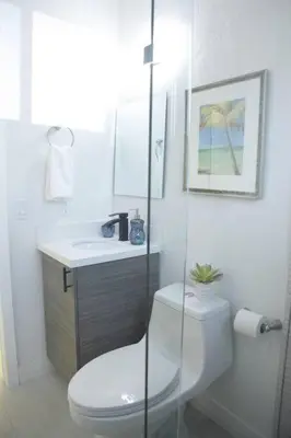 a white bathroom with a toilet and a sink at Apt 3 Miami Designer Apartment in the Upper East-Side in Miami