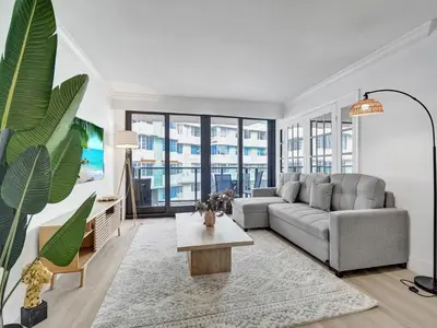a living room with a couch and a table at Comfortable Ocean View Condo Beach Service 1214 in Miami Beach