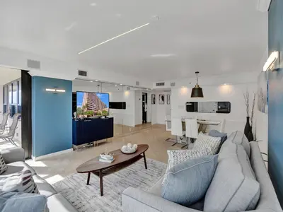 a living room with a couch and a table at Spacious Ocean View Condo Beach Service 803 in Miami Beach