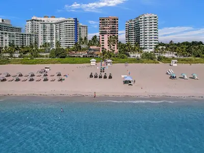 an aerial view of a beach with chairs and umbrellas at Full ocean view Huge private terrace 1002 in Miami Beach