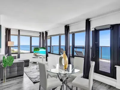 a living room with a view of the ocean at Full ocean view Huge private terrace 1002 in Miami Beach