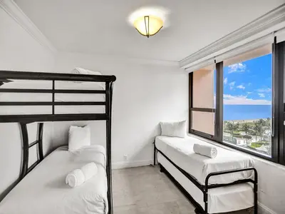 two bunk beds in a room with a window at Stylish Ocean Beach Retreat Beach Service 1009 in Miami Beach