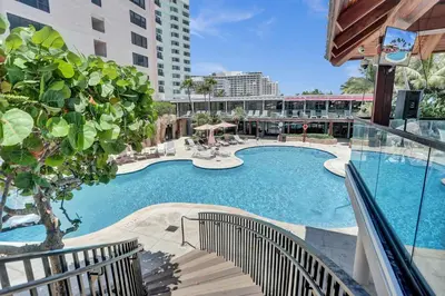 a large swimming pool in a building with a building at Luxury Oceanfront Condo Magnificent Views 701 in Miami Beach