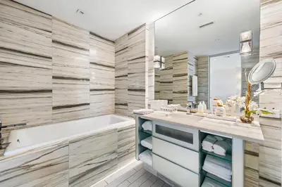 a bathroom with a tub and a sink at Oceanview Private Home at South Beach-814 in Miami Beach
