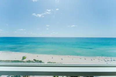 a view of a beach from a window at Miami Beach Oceanfront in Miami Beach