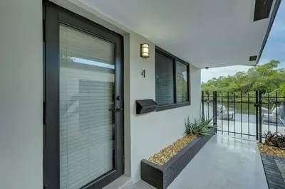 a door with blinds on a house at Waterfront Deck Pool Kayak in Fort Lauderdale