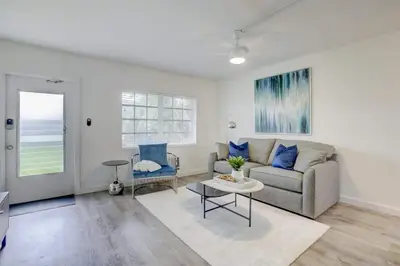 a living room with a couch and a table at Pool Free Wifi Parking Smart TV in Fort Lauderdale