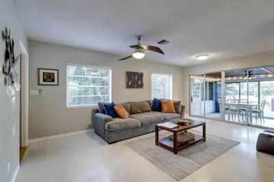 a living room with a couch and a table at Waterfront Apartment Private Patio Pool in Fort Lauderdale