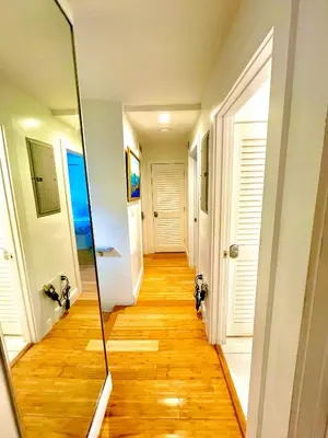 a hallway with a mirror on the floor at 12 GUESTS LUXURIOUS SOUTH BEACH SUITE 2 in Miami Beach