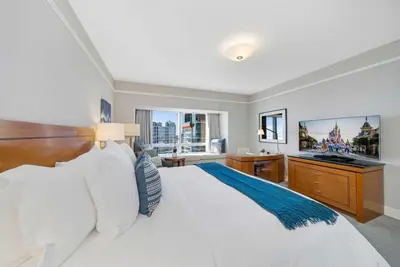 a bedroom with a large white bed and a sink at 1435 Brickell Ave 3004 in Miami