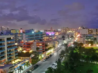 a city at night with buildings and street lights at BEST DEAL! 2 Bedroom Modern Beachfront by YouRent! in Miami Beach