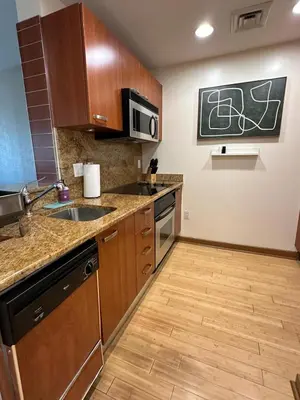 a kitchen with a sink and a microwave at Brickell 31th Floor Sea View Free Parking by Palermo Home Miami in Miami