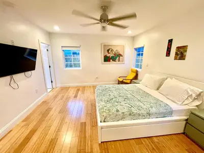 a bedroom with a bed and a ceiling fan at 20 GUESTS LUXURIOUS SOUTH BEACH SUITE 2 in Miami Beach