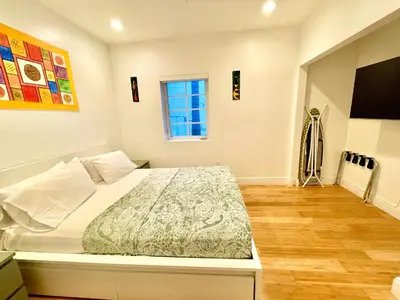 a bedroom with a bed and a window at 20 GUESTS LUXURIOUS SOUTH BEACH SUITE 2 in Miami Beach