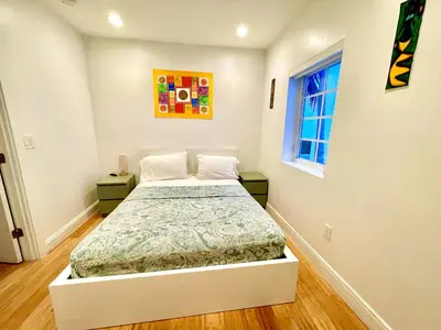 a bedroom with a bed and a window at 20 GUESTS LUXURIOUS SOUTH BEACH SUITE 2 in Miami Beach