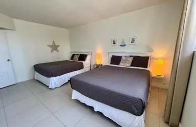 a hotel room with two beds and two lamps at Special $$$! 2 Bedroom Oceanfront Condo in Hollywood/Hallandale Beach! in Hollywood