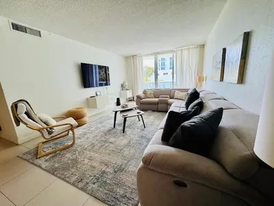 a large living room with a couch and chairs at Special $$$! 2 Bedroom Oceanfront Condo in Hollywood/Hallandale Beach! in Hollywood