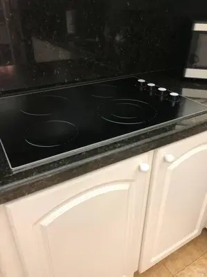 a black stove top oven sitting on top of a kitchen counter at Special $$$! 2 Bedroom Oceanfront Condo in Hollywood/Hallandale Beach! in Hollywood