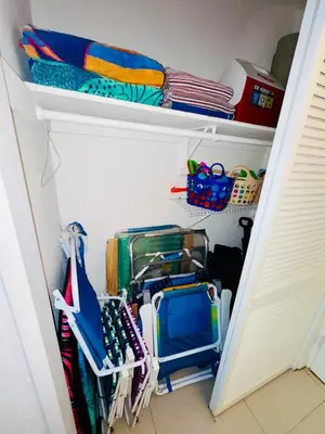 a closet filled with lots of office supplies at Special $$$! 2 Bedroom Oceanfront Condo in Hollywood/Hallandale Beach! in Hollywood