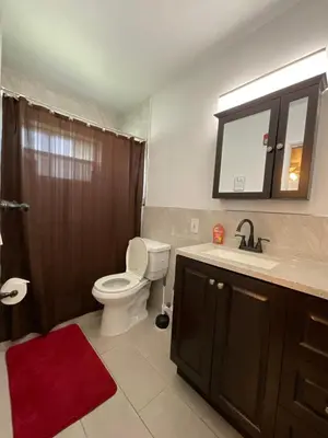 a bathroom with a toilet and a sink and a shower at Private Studio Near Guitar Casino & Stadium in Carver Ranches