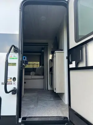 an open door of an rv with a bed at Free BBQ in RV With Private entrance in Homestead