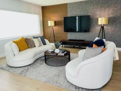a living room with two white couches and a tv at Stylish Room close to everything in Miami in Miami Shores