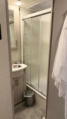 a bathroom with a shower and a sink at Private Cozy R/V , for your enjoyment in Tamiami